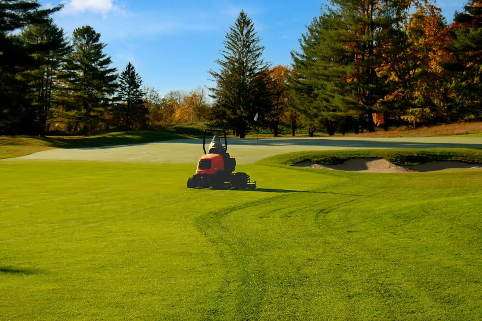 golf course groudstaff mowing